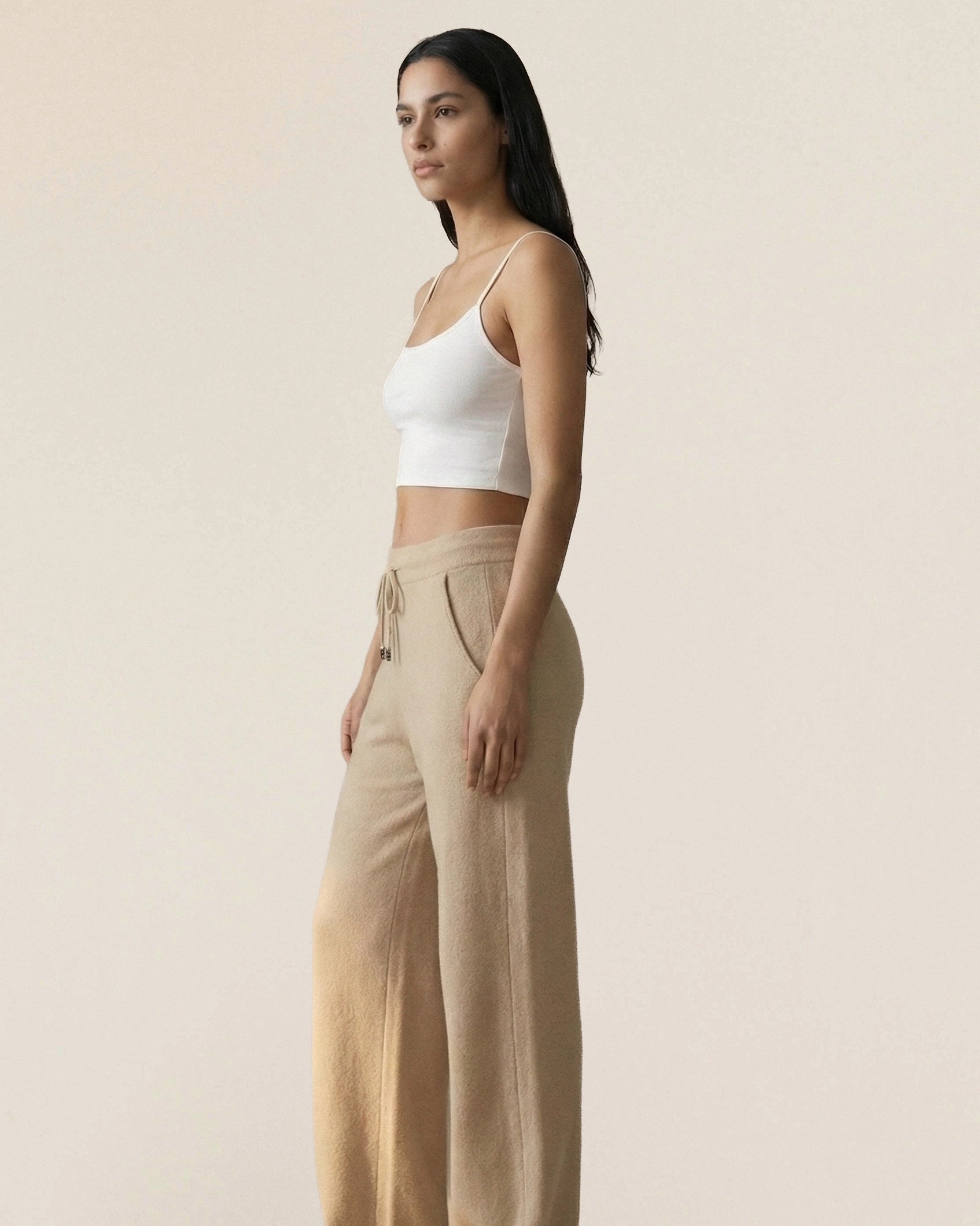 Vionis·XY side profile of ecru wide-leg cashmere trousers, dense 510g fabric offering full coverage and structure