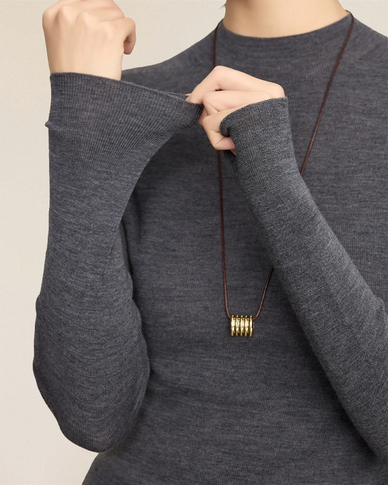 VIONIS·XY close-up of charcoal grey ribbed merino knit, 16μm ultra-fine merino wool texture