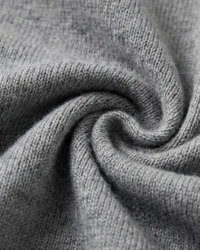 VIONIS·XY close-up of ribbed knit texture in heather grey, 16μm ultra-fine merino wool from Südwolle Group