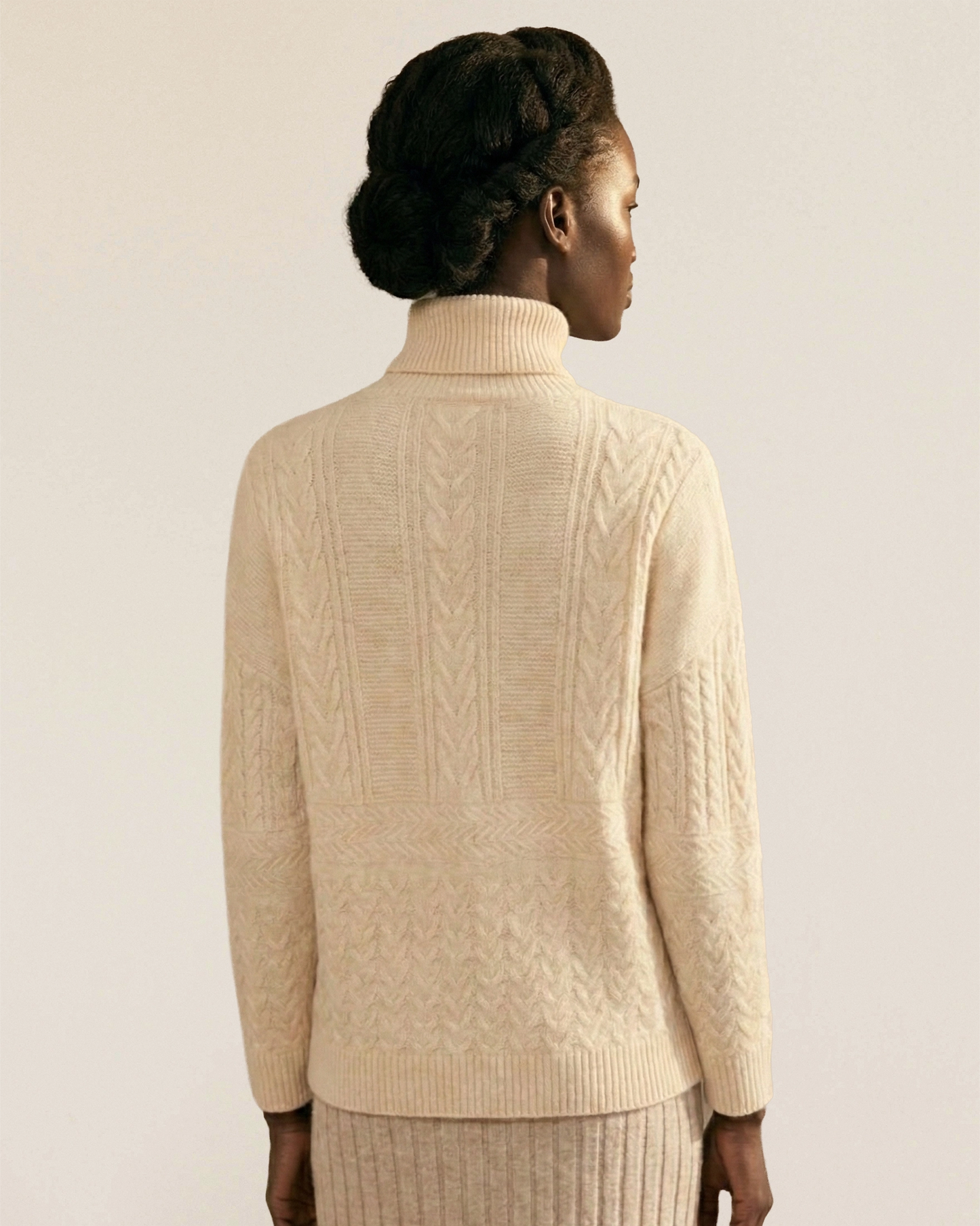 VIONIS·XY side view of ecru cable knit turtleneck, relaxed silhouette in 320g 100% Inner Mongolia cashmere