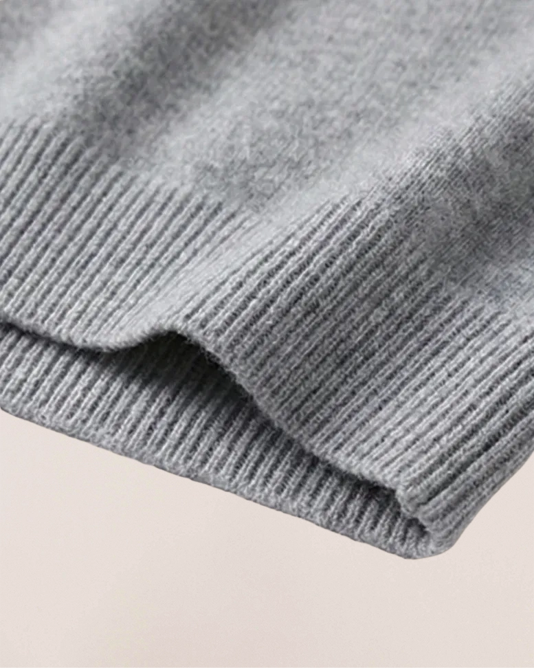 Ribbed hem detail of VIONIS·XY 100% Inner Mongolia Cashmere sweater in Heather Grey
