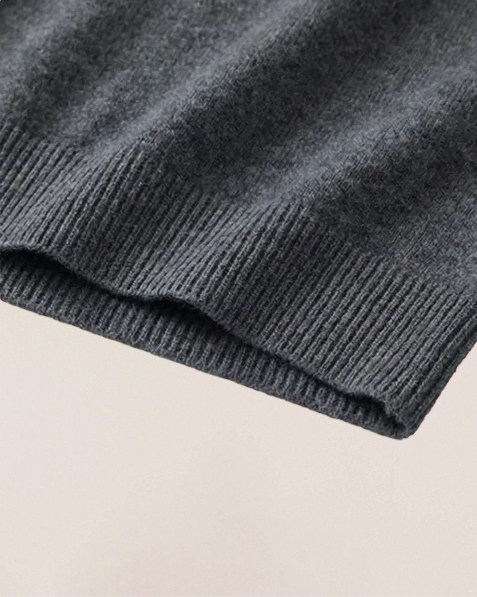 Ribbed hem detail of VIONIS·XY 280g 100% Inner Mongolia Cashmere sweater in Charcoal Grey