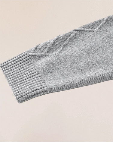 Sleeve cuff detail of VIONIS·XY heather grey cashmere sweater, refined ribbing with substantial weight