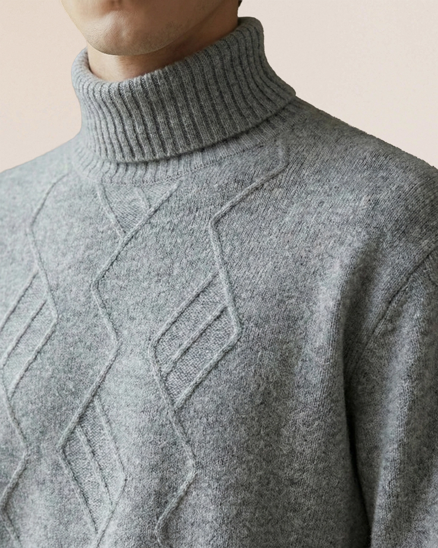 Close-up of VIONIS·XY heather grey cashmere knit, raised geometric pattern in 100% Mongolian cashmere