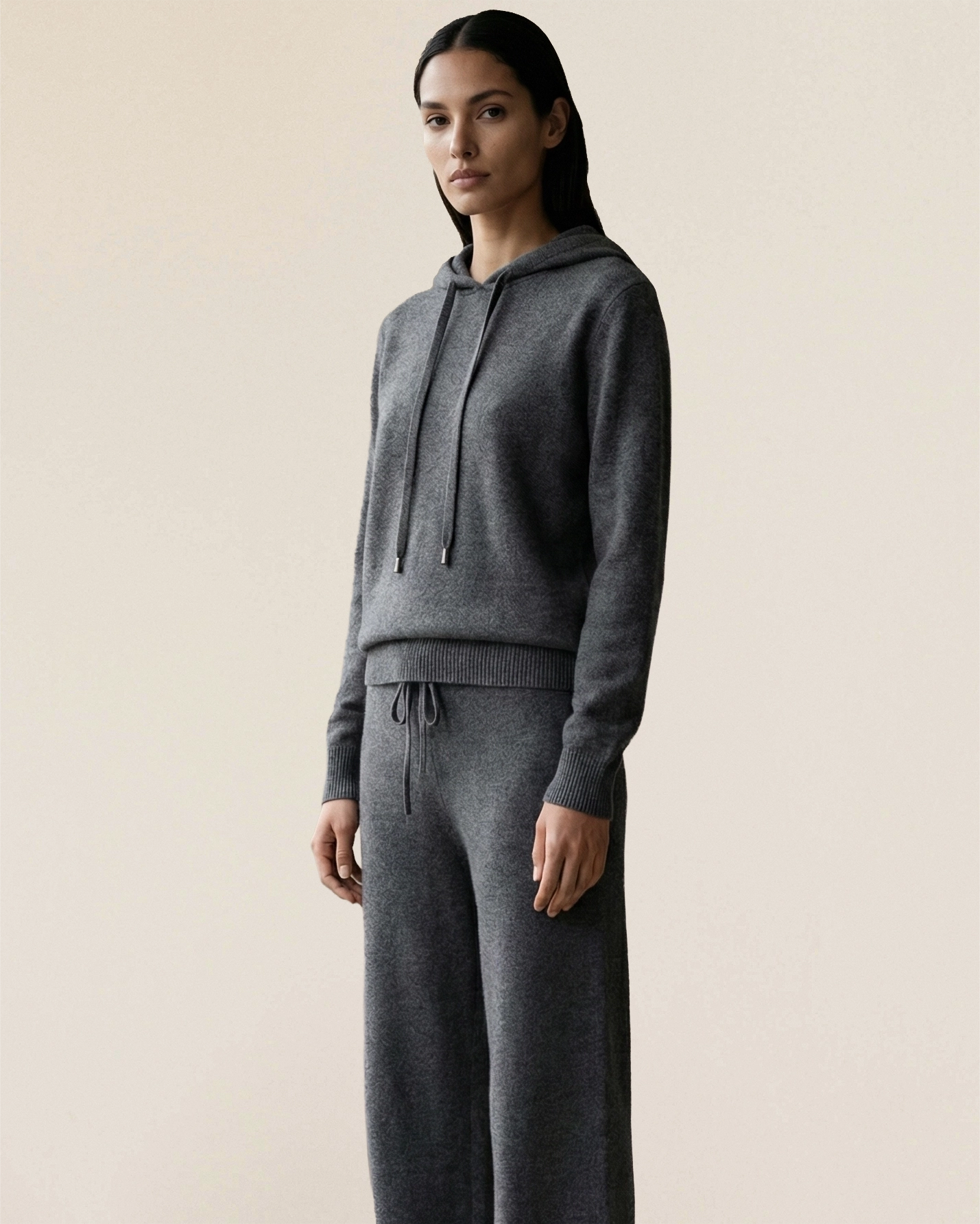 Model wearing VIONIS·XY charcoal grey cashmere set, quiet luxury silhouette with natural drape
