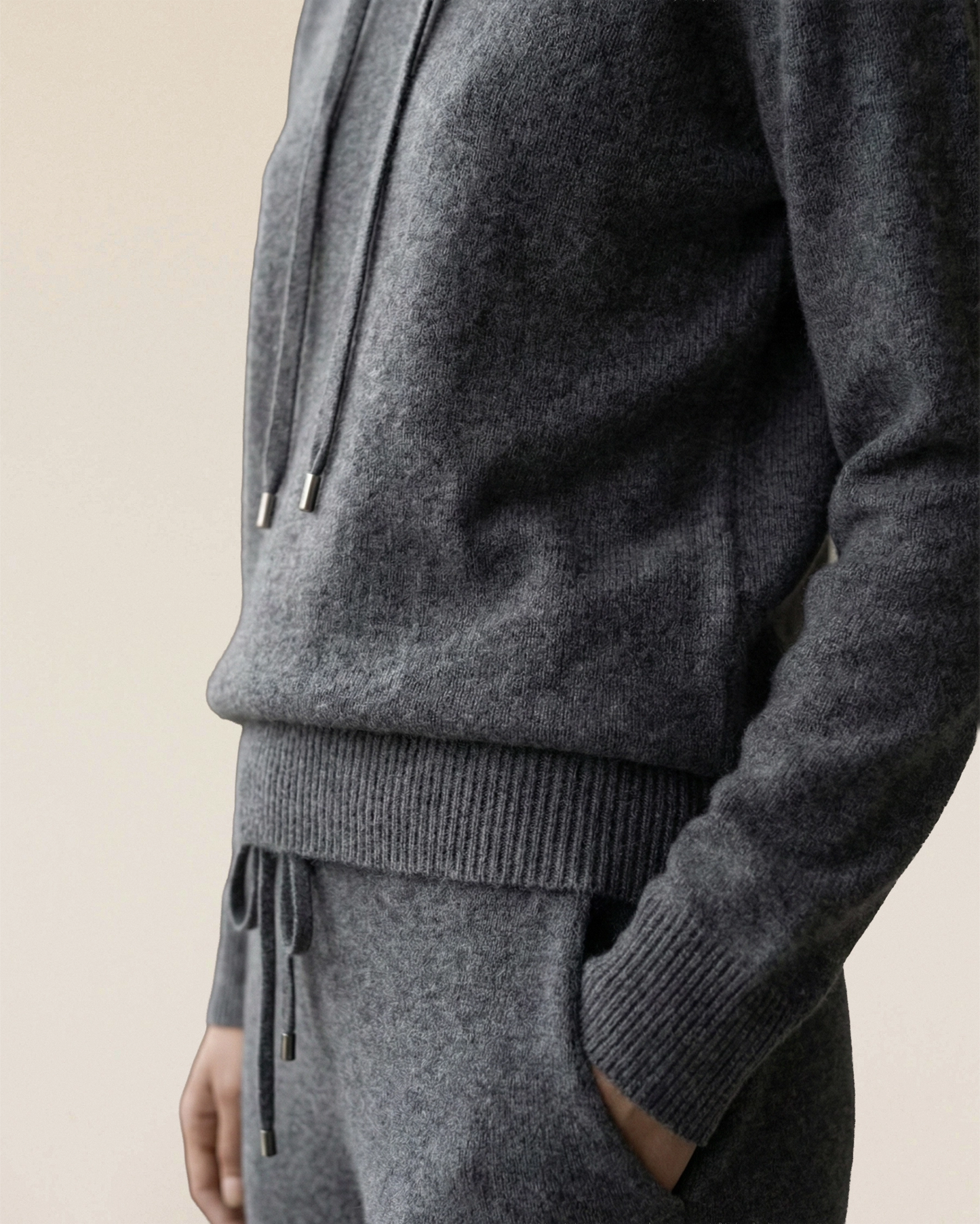 Detail of VIONIS·XY charcoal grey cashmere hoodie, dense knit with a refined texture
