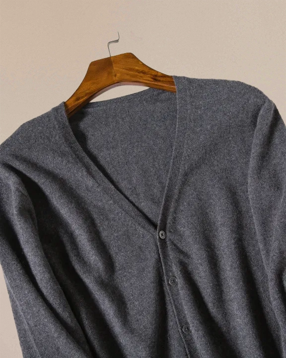 Detail of VIONIS·XY charcoal grey cardigan front placket and buttons