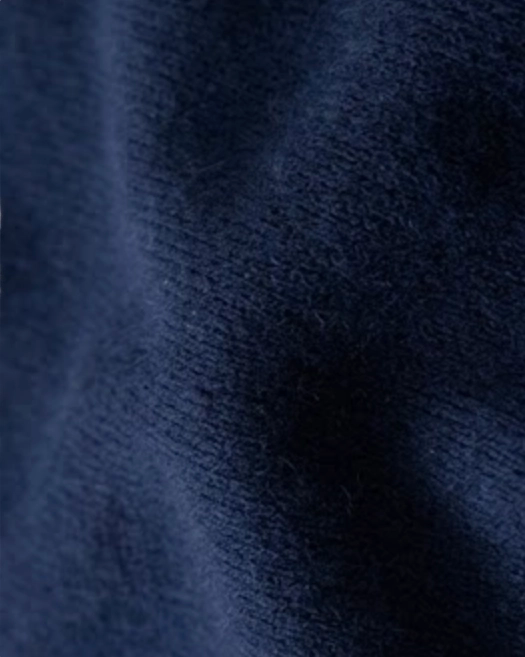 Close-up of VIONIS·XY slate blue cashmere knit, smooth 12-gauge texture